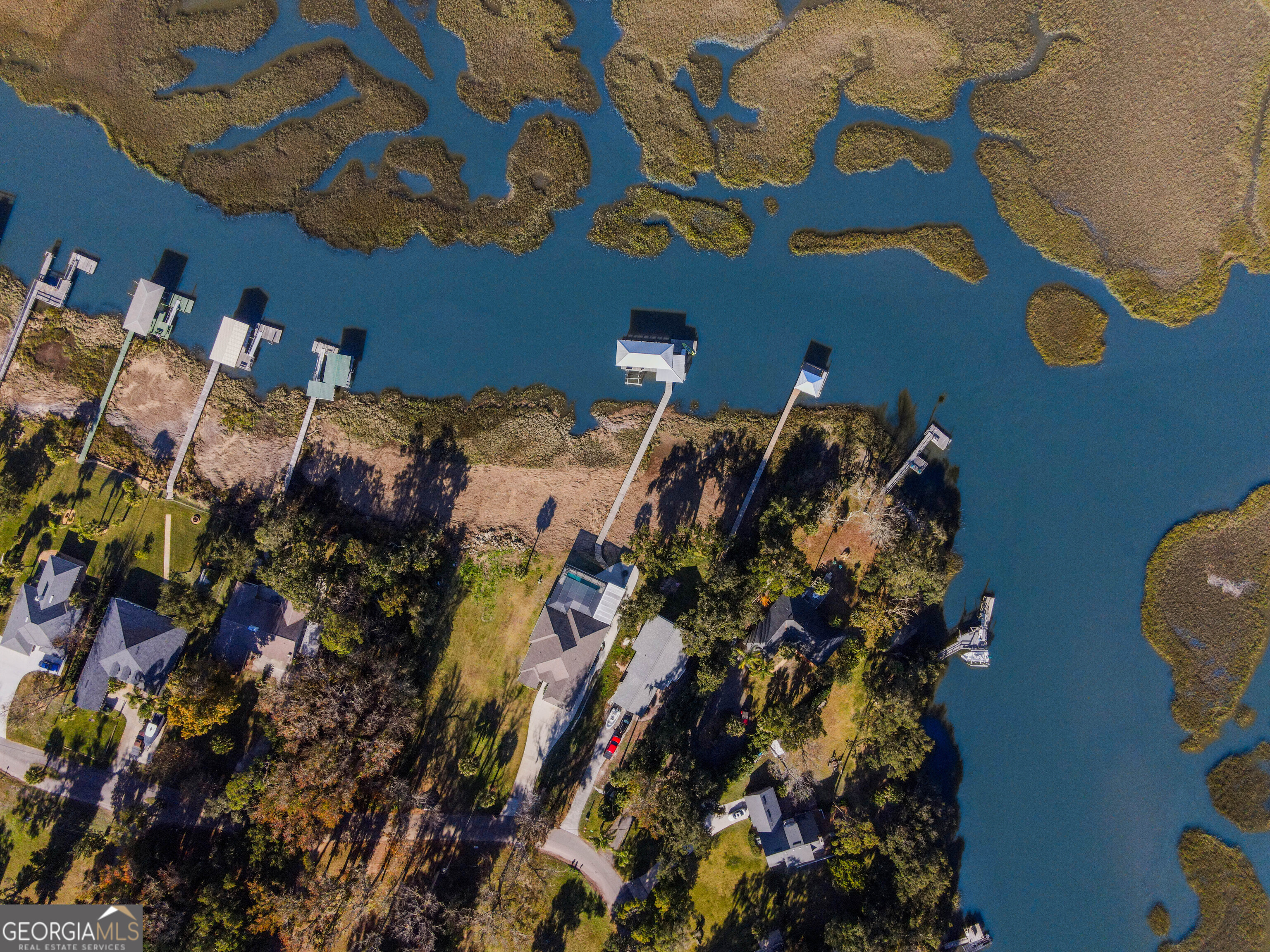 97222 Pirates Point Road Yulee, FL 32097 - Photo 80 of 82 a bed sitting in a bedroom next to a window