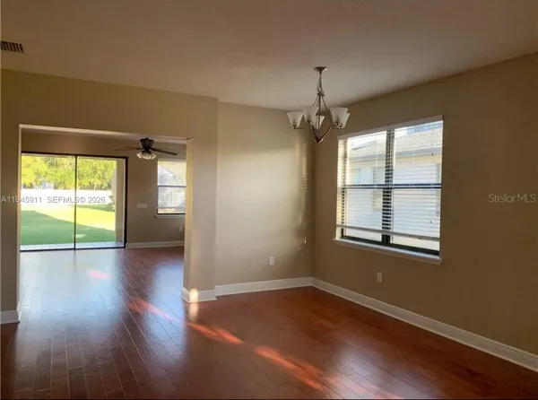 a view of livingroom with window fireplace and wooden floor
