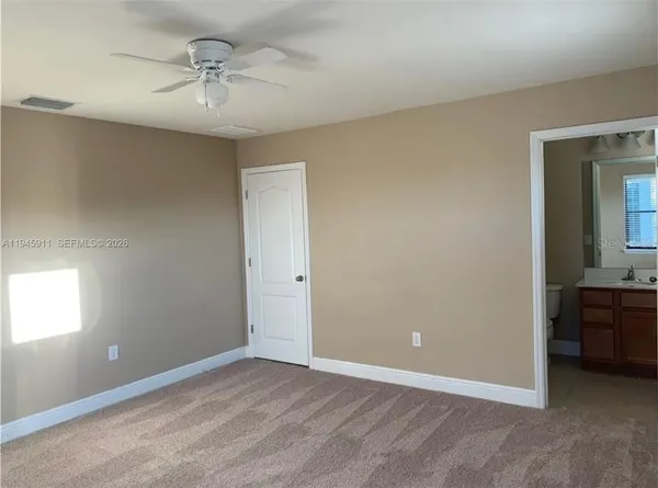 a view of a chandelier fan in a room
