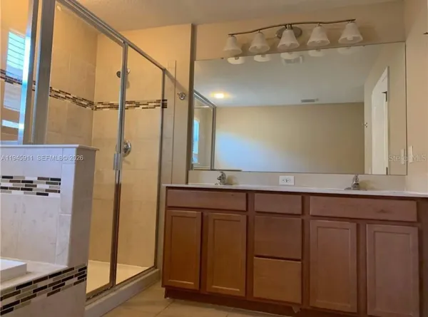 a bathroom with a tub and a shower