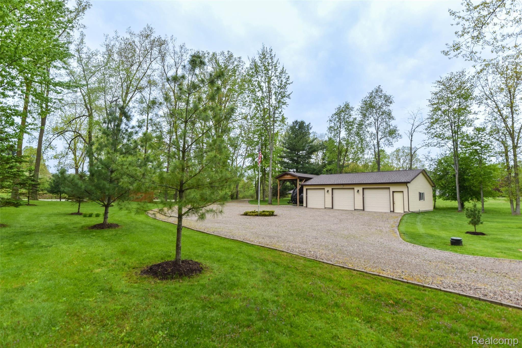 5520 Lowe Road Fowlerville, MI 48836 - Photo 76 of 86 5520-W-Lowe-Rd-63 Outside Garage.jpg