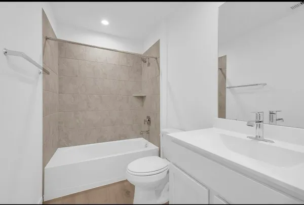 a bathroom with a sink a toilet and a bathtub
