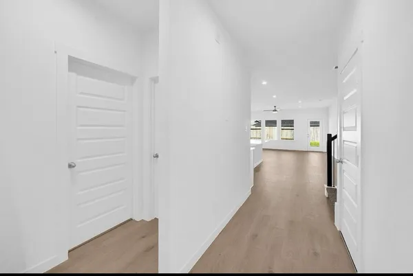 a view of a kitchen with refrigerator and a stove