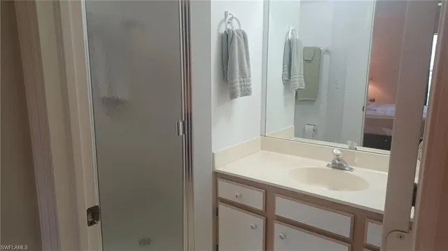 a bathroom with a sink and a mirror