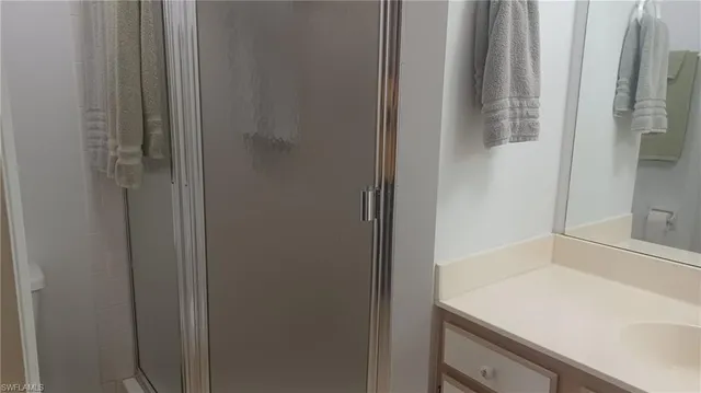 a bathroom with a sink and vanity