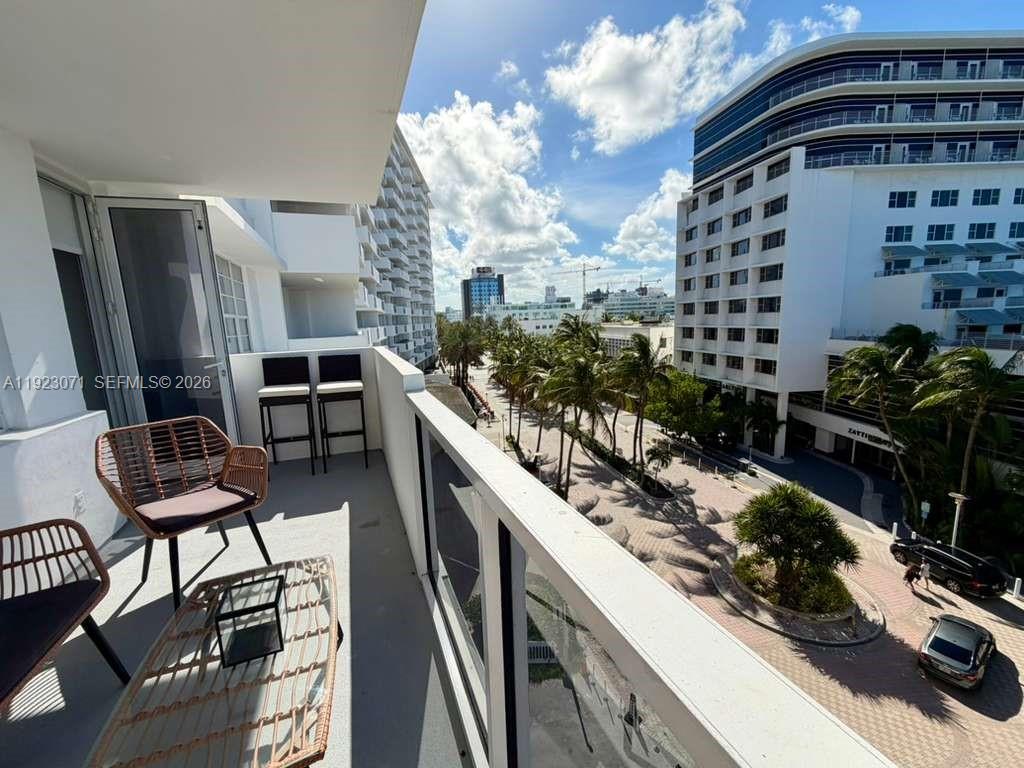 100 Lincoln Road, Unit 541 Miami Beach, FL 33139 - Photo 17 of 17 a view of a balcony with chairs