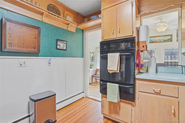 a kitchen with stainless steel appliances granite countertop a refrigerator and a stove
