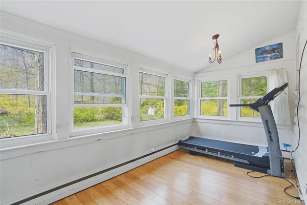a view of an empty room with windows