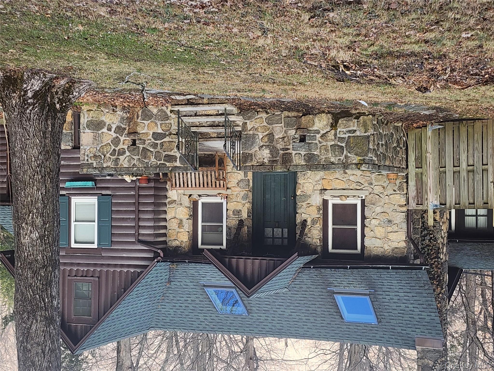 167 Highland Road Cold Spring, NY 10516 - Photo 3 of 11 a front view of a house with garden