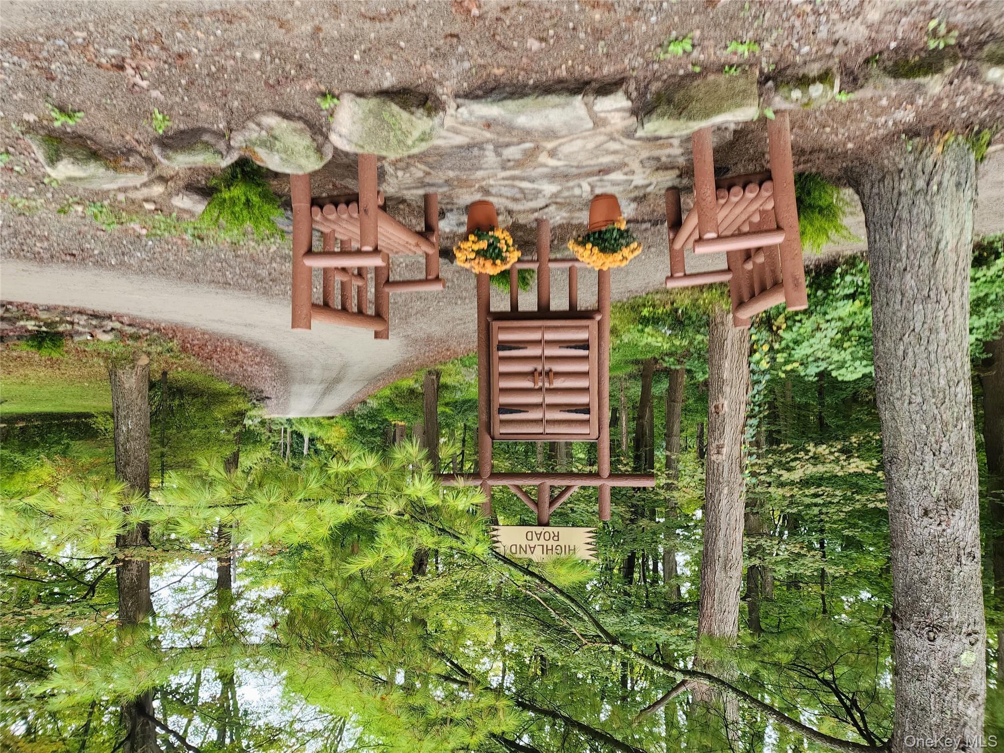 167 Highland Road Cold Spring, NY 10516 - Photo 5 of 11 a backyard of a house with table and chairs