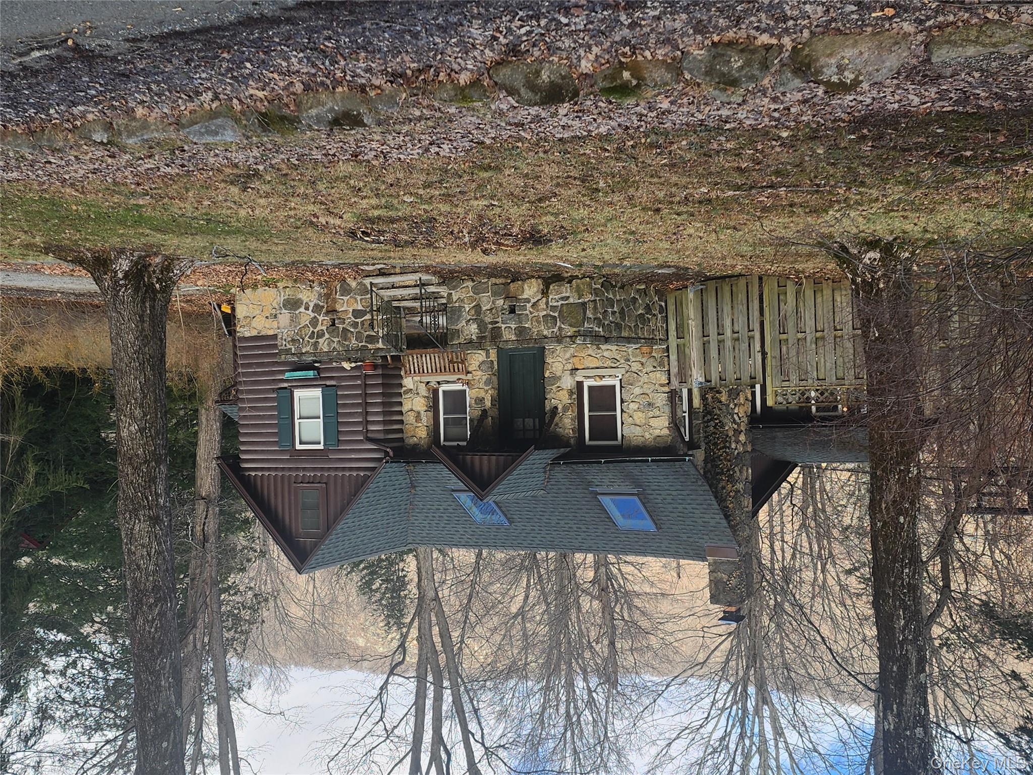 167 Highland Road Cold Spring, NY 10516 - Photo 6 of 11 a front view of a house with a yard