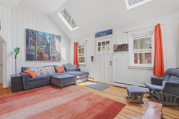 a living room with furniture and a window