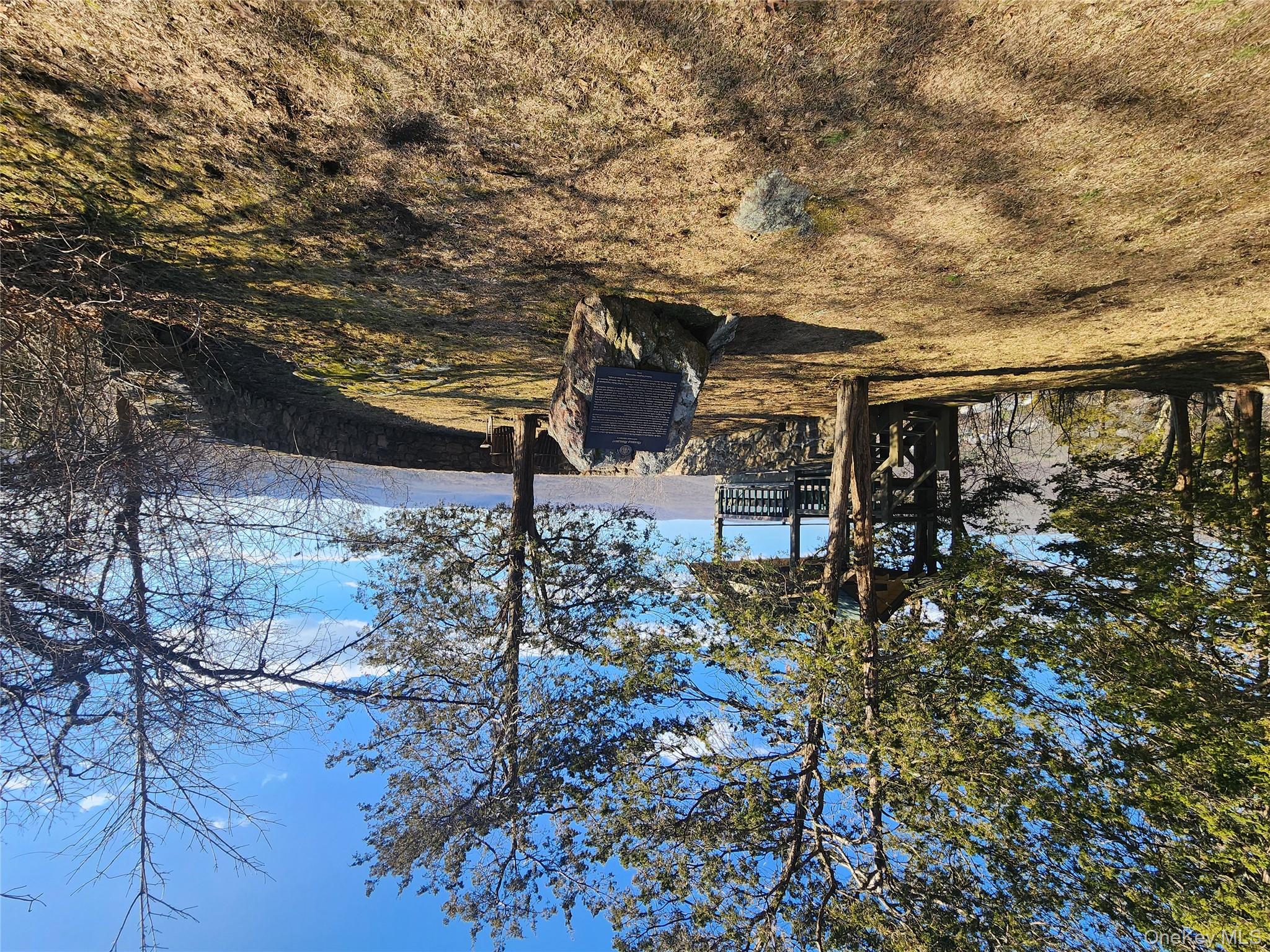 167 Highland Road Cold Spring, NY 10516 - Photo 10 of 11 a view of backyard with wooden fence and a large tree