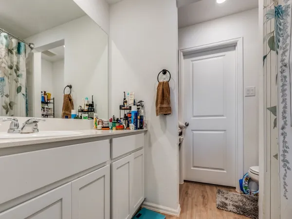 a en suite bathroom with a sink and mirror