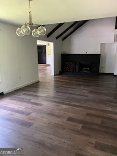 a view of a fireplace with wooden floor