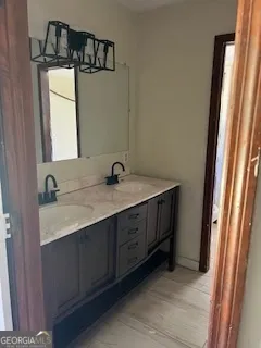 a bathroom with a double vanity sink and mirror