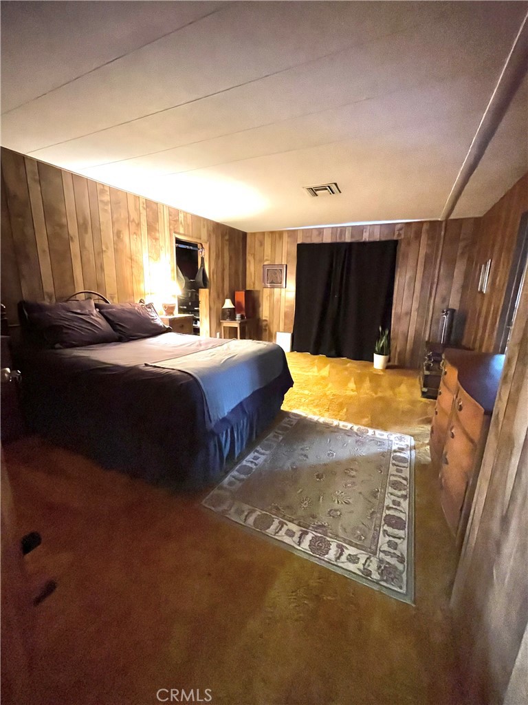 31348 North Lakehills Road, Unit 2 Castaic, CA 91384 - Photo 16 of 42 a bed room with two bed and a night stand