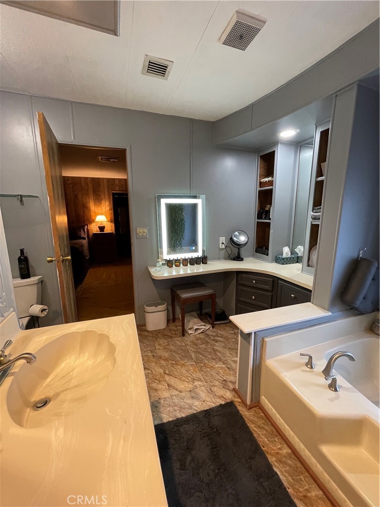31348 North Lakehills Road, Unit 2 Castaic, CA 91384 - Photo 20 of 42 a bathroom with a sink and a mirror