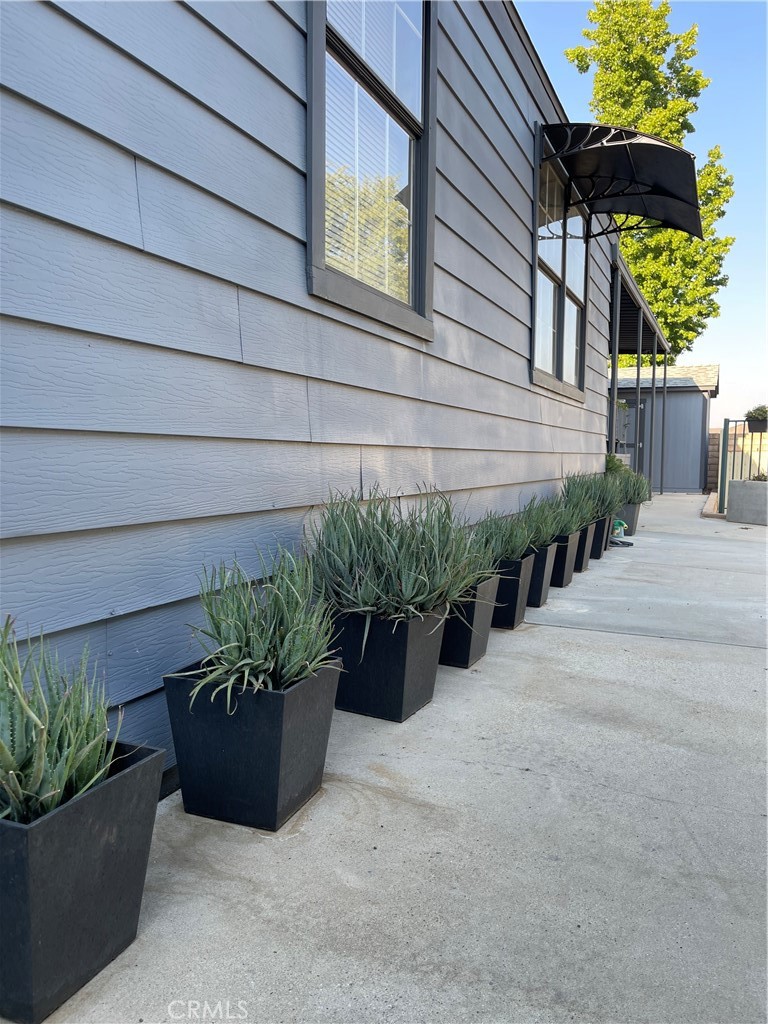31348 North Lakehills Road, Unit 2 Castaic, CA 91384 - Photo 2 of 42 a view of a garden filled with furniture