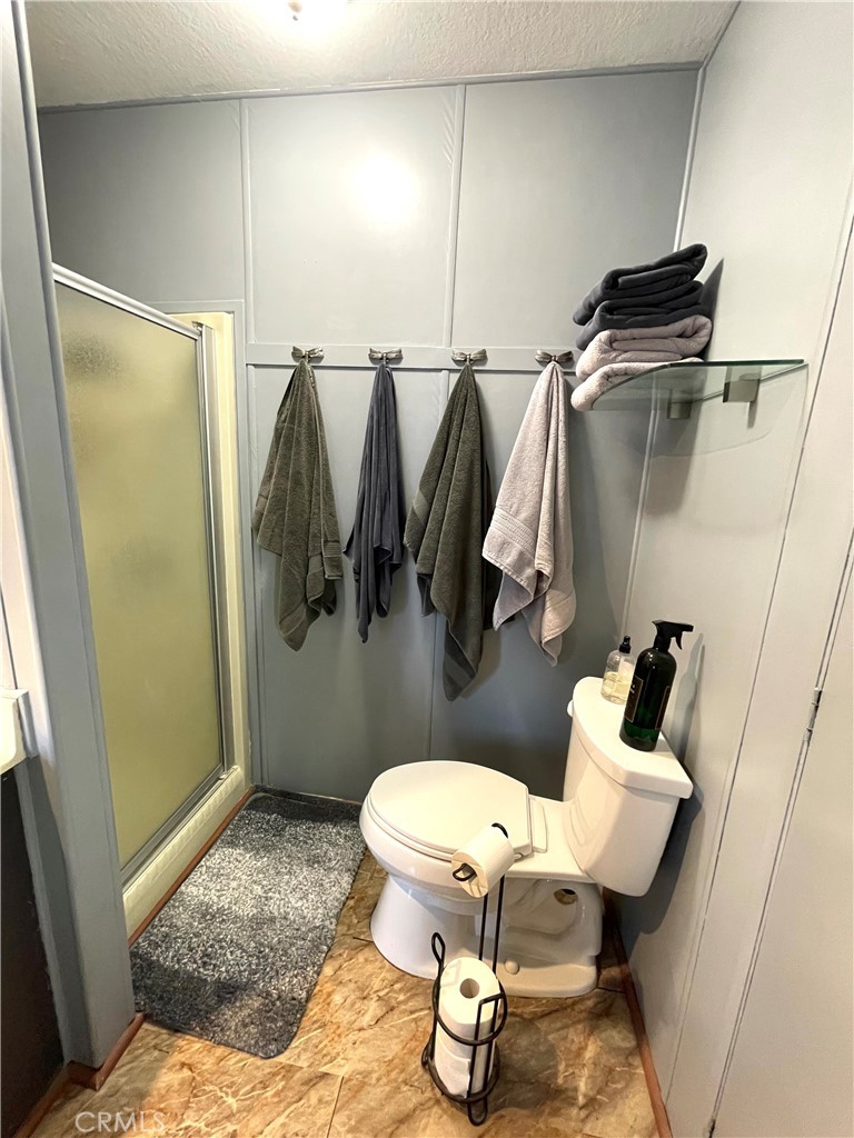 31348 North Lakehills Road, Unit 2 Castaic, CA 91384 - Photo 22 of 42 a bathroom with a toilet and a shower