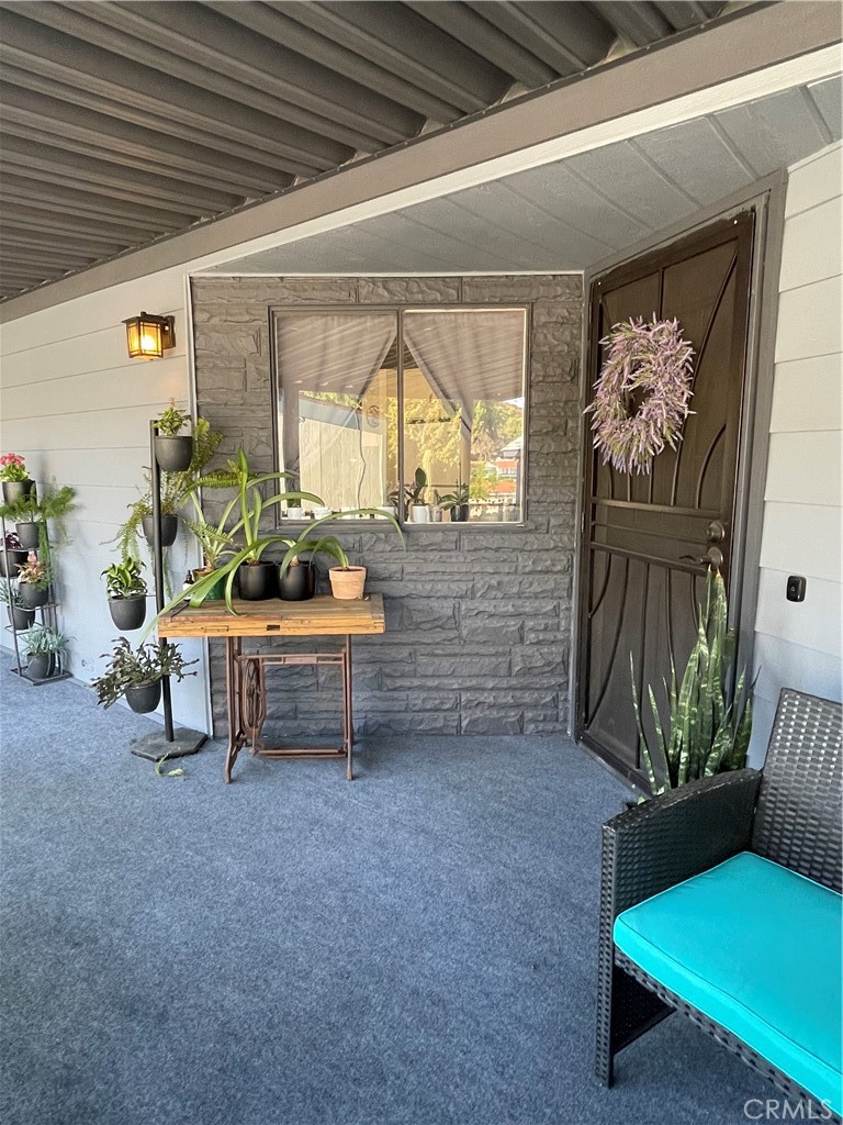 31348 North Lakehills Road, Unit 2 Castaic, CA 91384 - Photo 9 of 42 a outdoor living space with furniture and a potted plant
