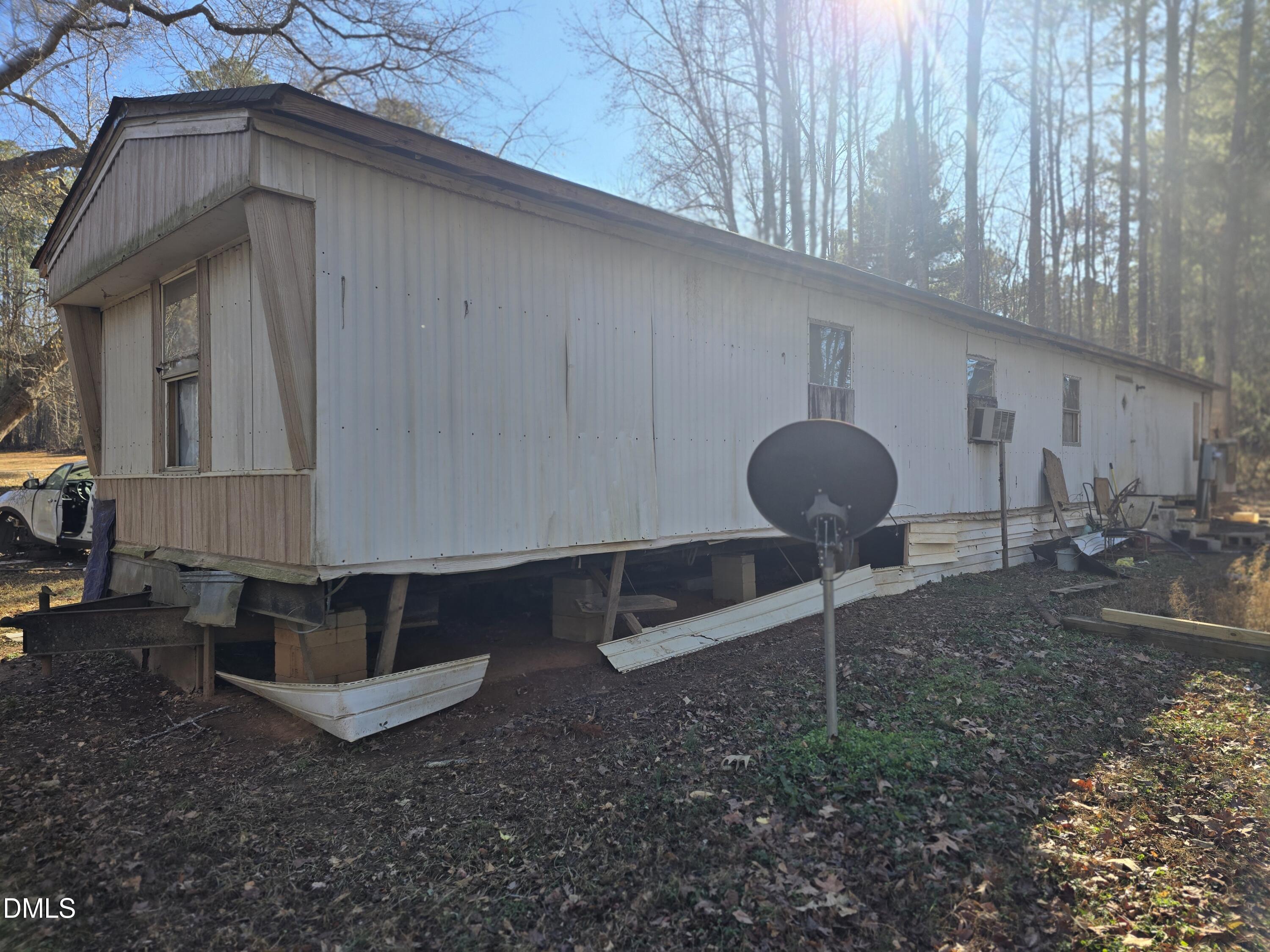 6782 Pinecrest Road Zebulon, NC 27597 - Photo 2 of 13 a backyard of a house with barbeque oven