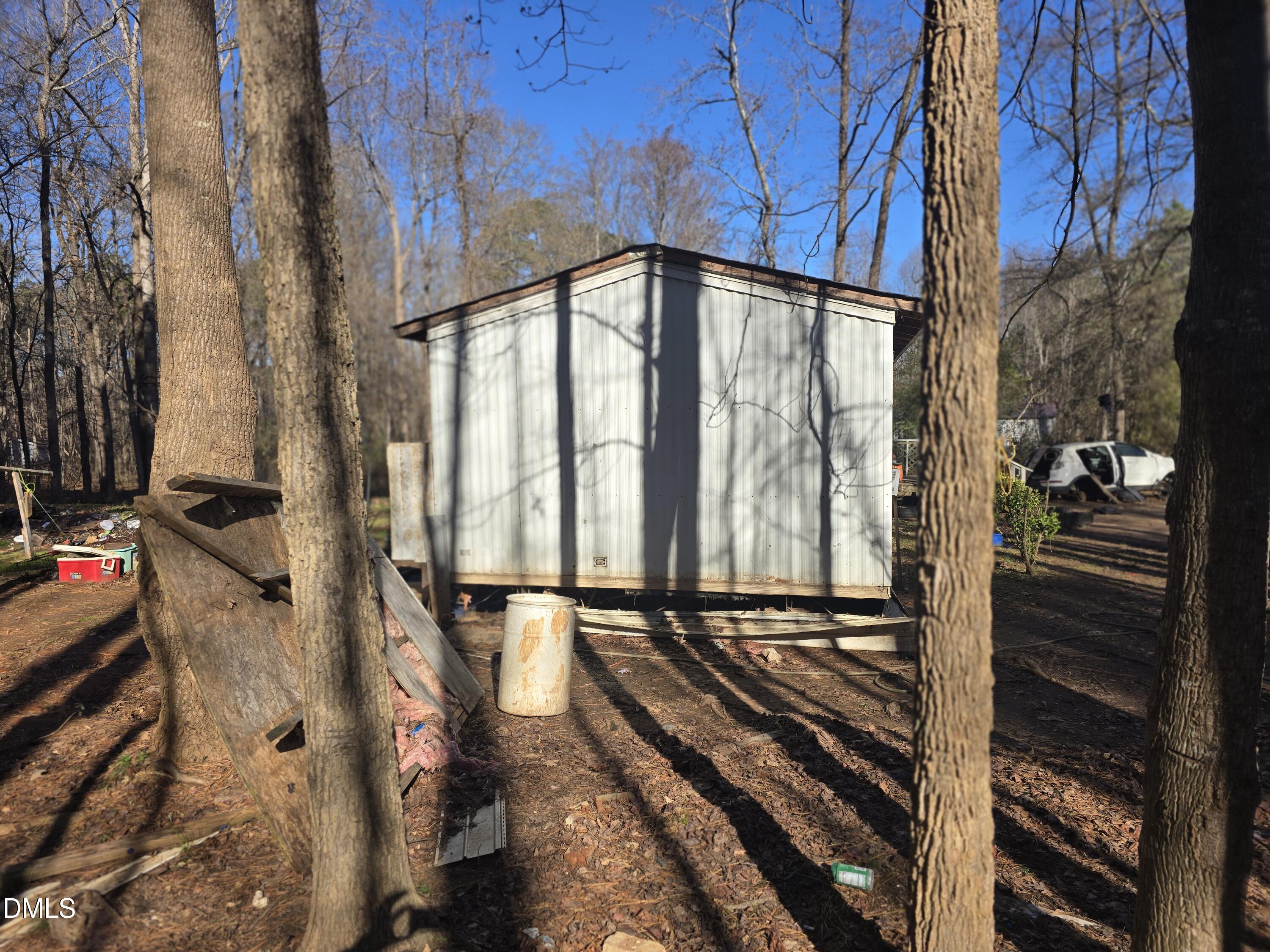6782 Pinecrest Road Zebulon, NC 27597 - Photo 5 of 13 a view of a room with wooden floor and iron stairs