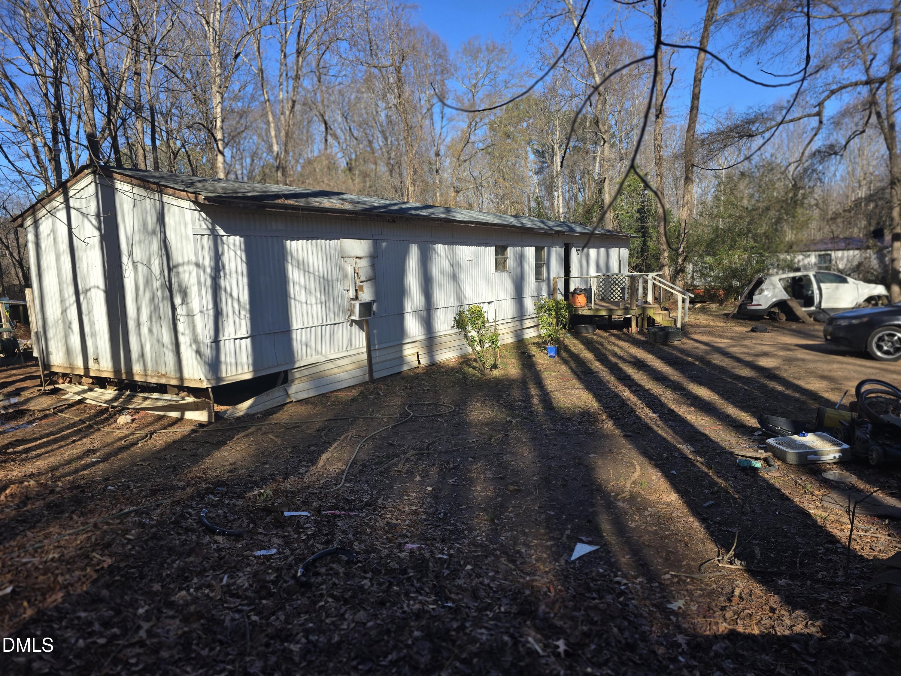 6782 Pinecrest Road Zebulon, NC 27597 - Photo 6 of 13 a view of a house with a yard