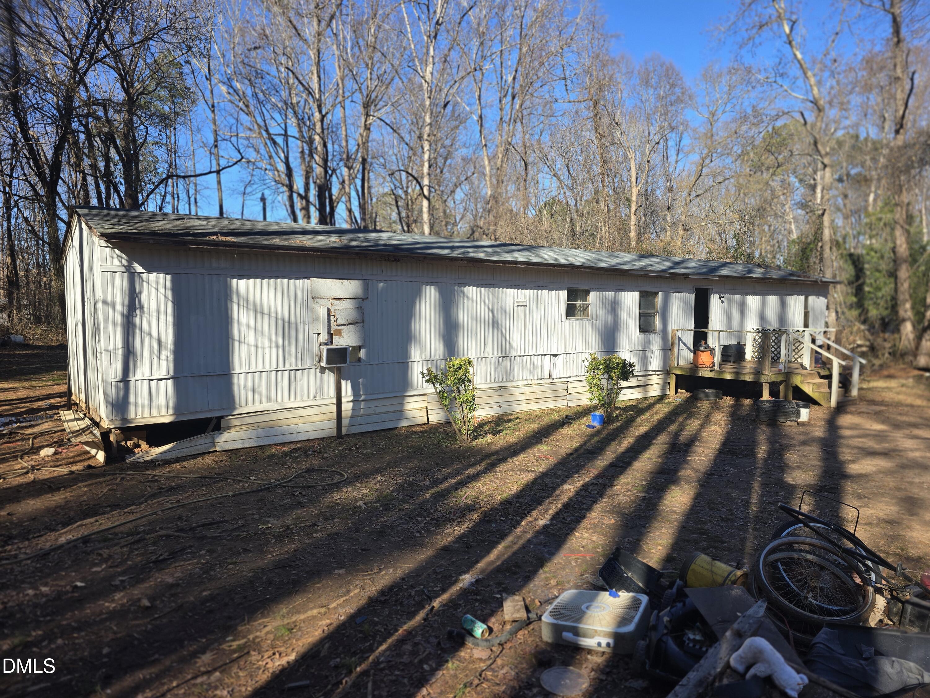6782 Pinecrest Road Zebulon, NC 27597 - Photo 7 of 13 a view of a street with wooden fence