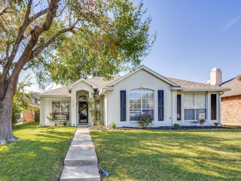 Single story home with a front lawn, brick siding, roof with shingles, and a chimney