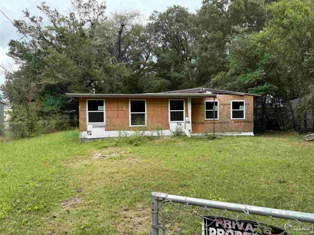 a backyard of a house with seating space