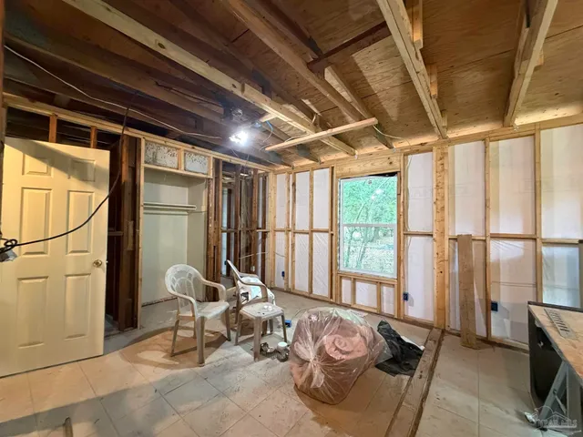 a room with furniture and a window