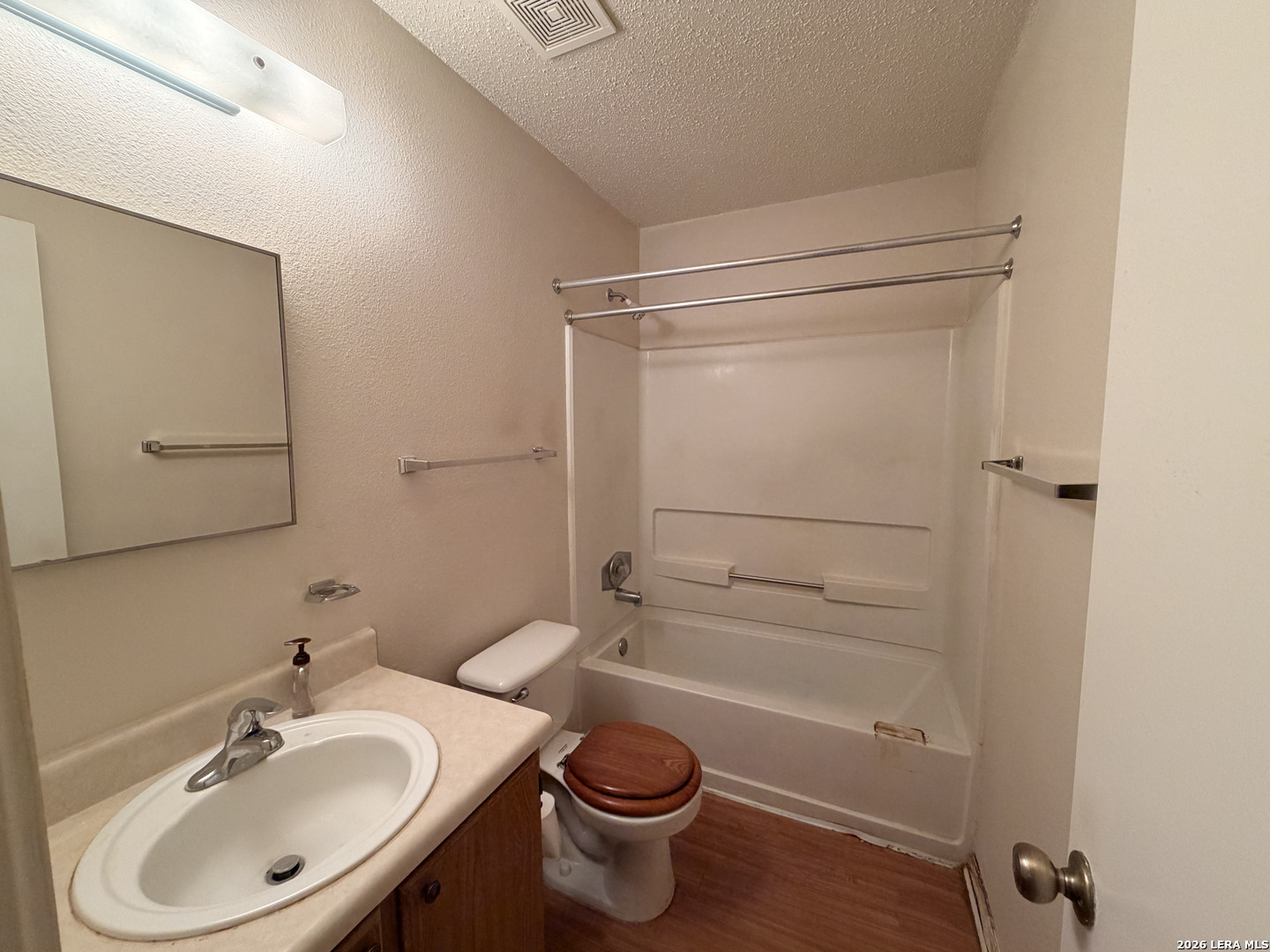 8349 Morning Grove Converse, TX 78109 - Photo 12 of 27 a bathroom with a sink toilet and shower