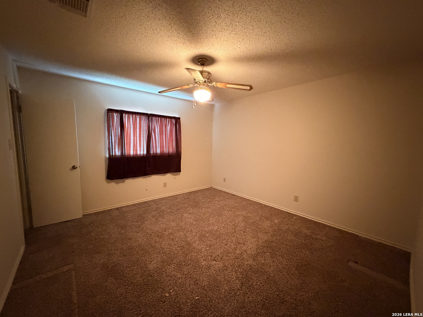 8349 Morning Grove Converse, TX 78109 - Photo 14 of 27 en empty room with windows and fan