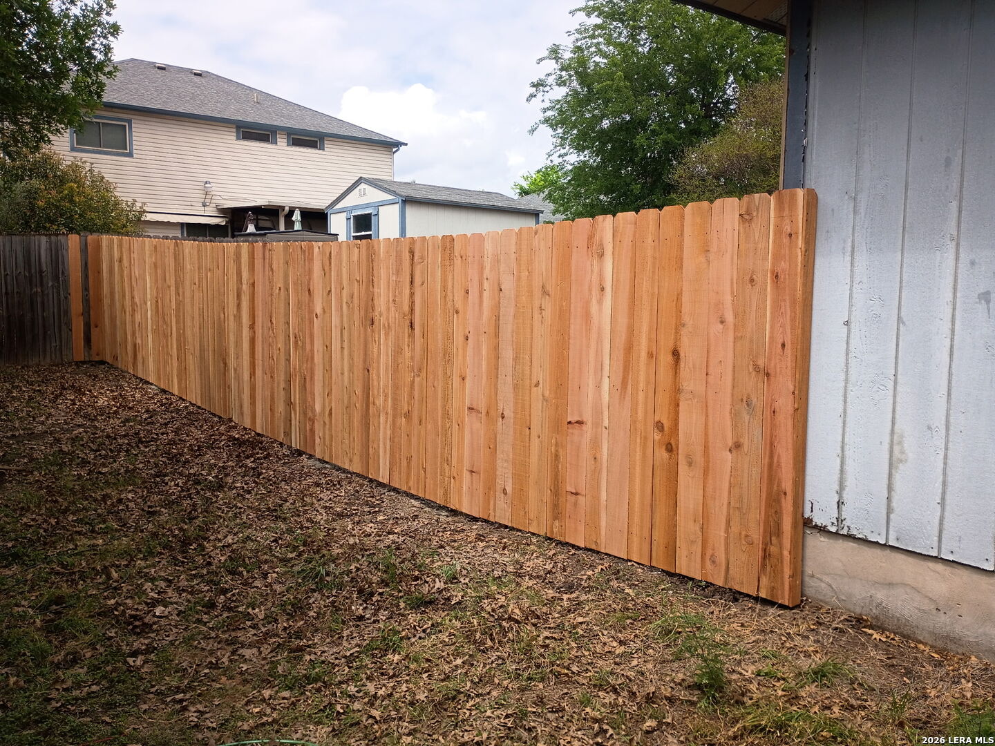 8349 Morning Grove Converse, TX 78109 - Photo 23 of 27 a view of a backyard with wooden fence