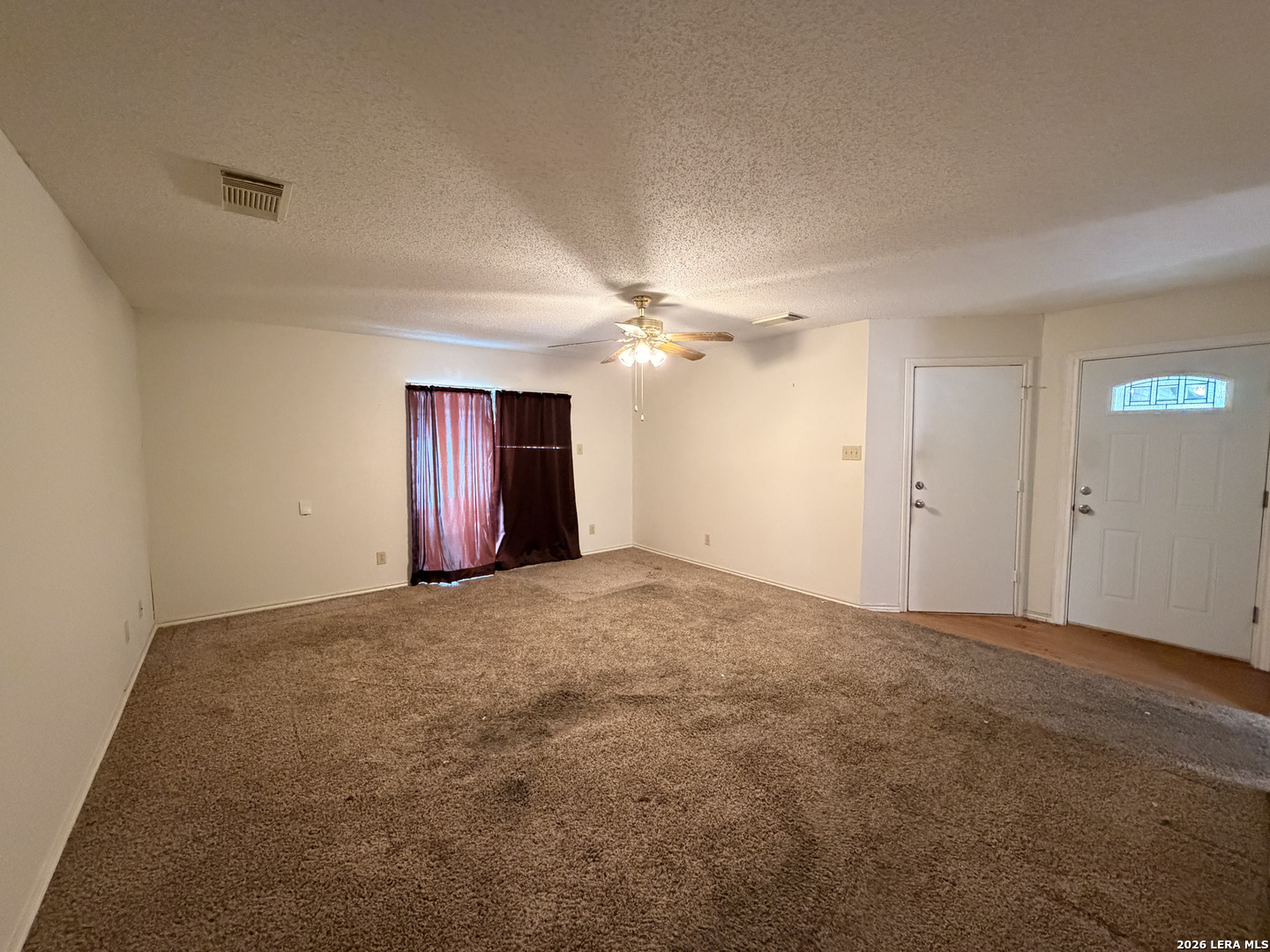 8349 Morning Grove Converse, TX 78109 - Photo 3 of 27 a view of an empty room with a ceiling fan