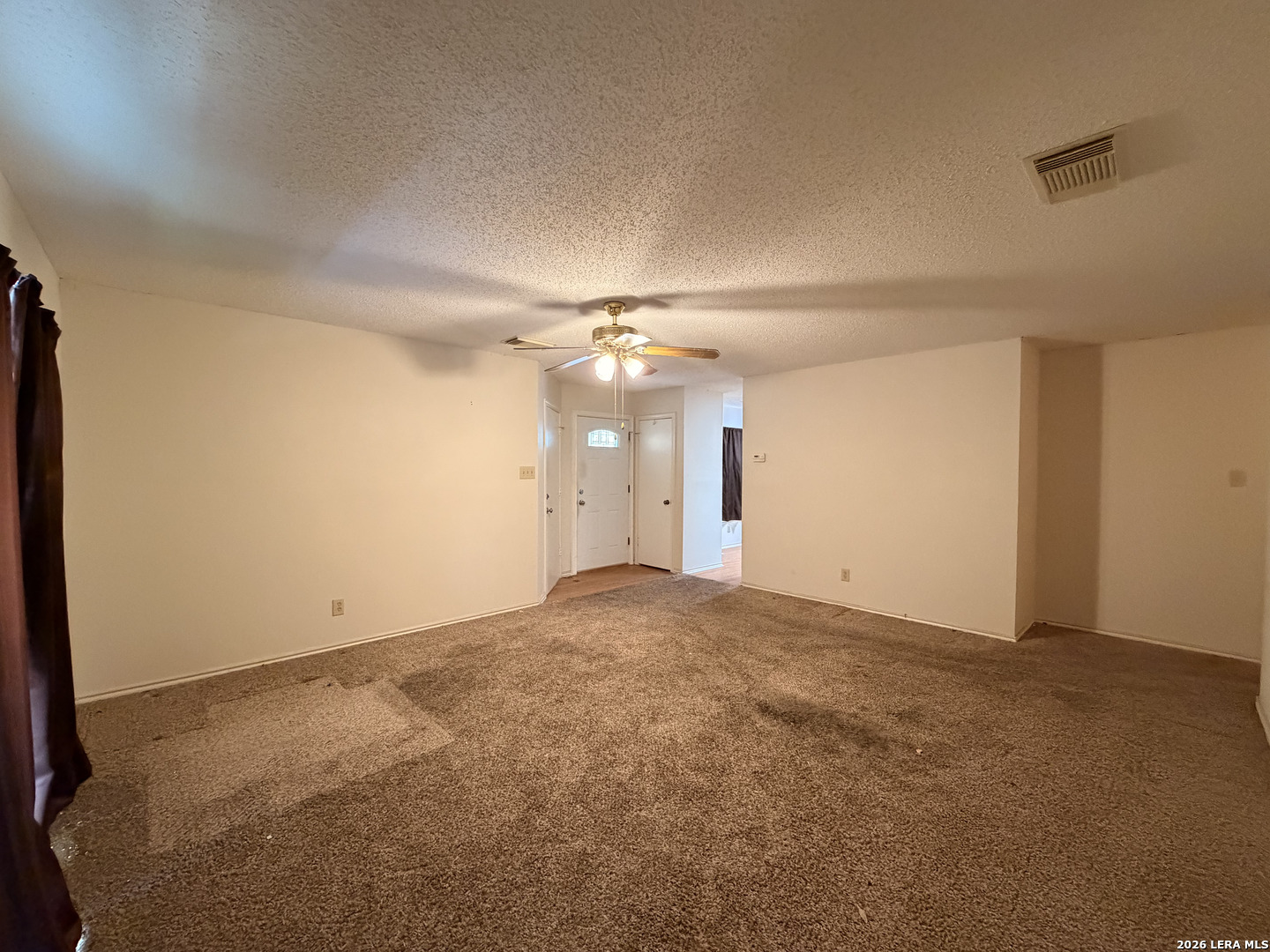 8349 Morning Grove Converse, TX 78109 - Photo 4 of 27 a view of an empty room with a ceiling fan