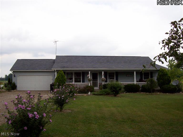 8245 Ruff Road West Salem, OH 44287 - Photo 1 of 25 Welcome to 8245 Ruff Rd. Own a piece of the country. 7x24 covered front porch. Composite railing was just done in July 2013. Easy maintenance. Relax on summer days and just sit there and enjoy the views!!!