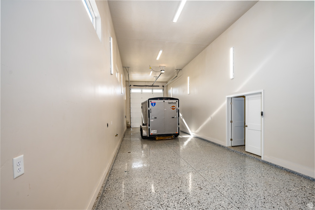 1283 North Gallen Road Santa Clara, UT 84765 - Photo 89 of 103 Detached Large RV Garage featuring baseboards and epoxy flooring.