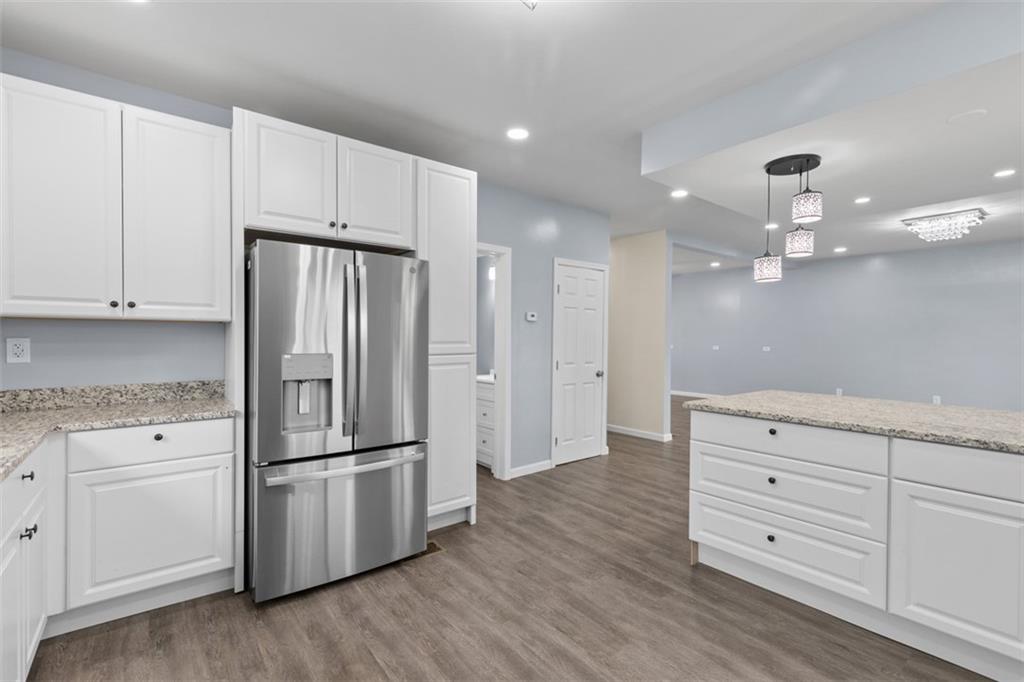 519 Center Street Carnegie, PA 15106 - Photo 11 of 44 a kitchen with granite countertop white cabinets and stainless steel appliances