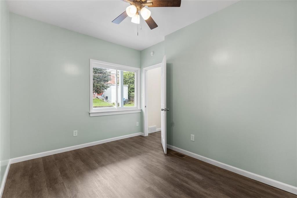519 Center Street Carnegie, PA 15106 - Photo 13 of 44 wooden floor in an empty room with a window