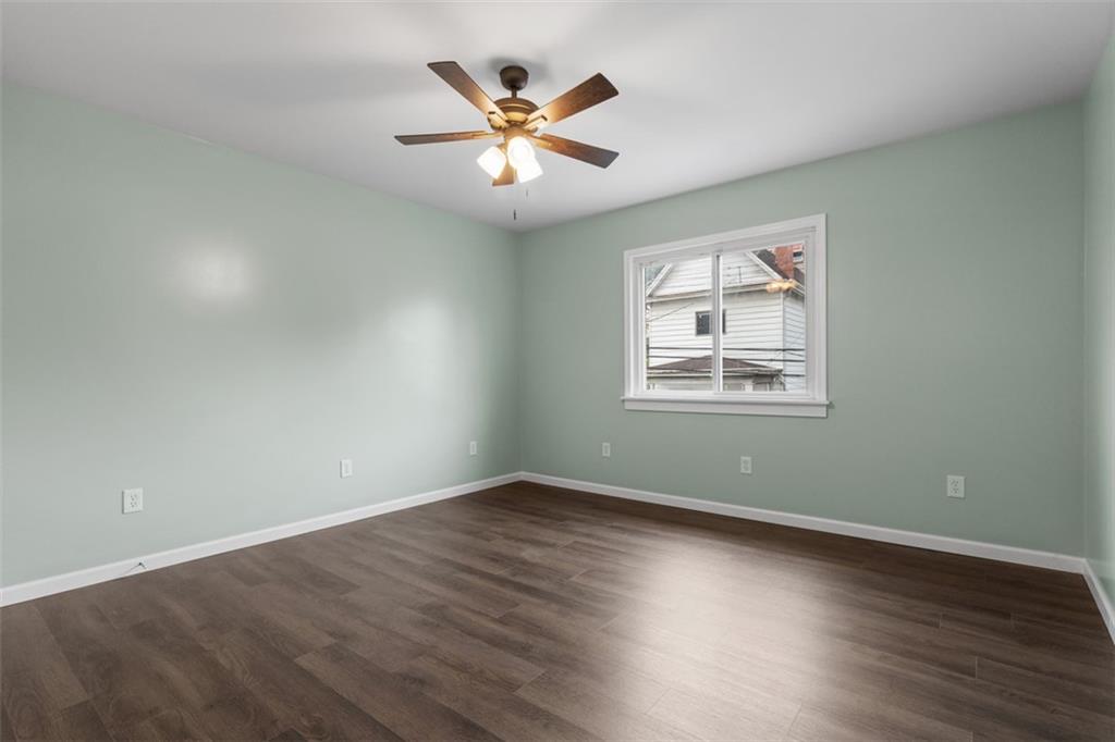 519 Center Street Carnegie, PA 15106 - Photo 25 of 44 a view of wooden floor and a chandelier fan in a room