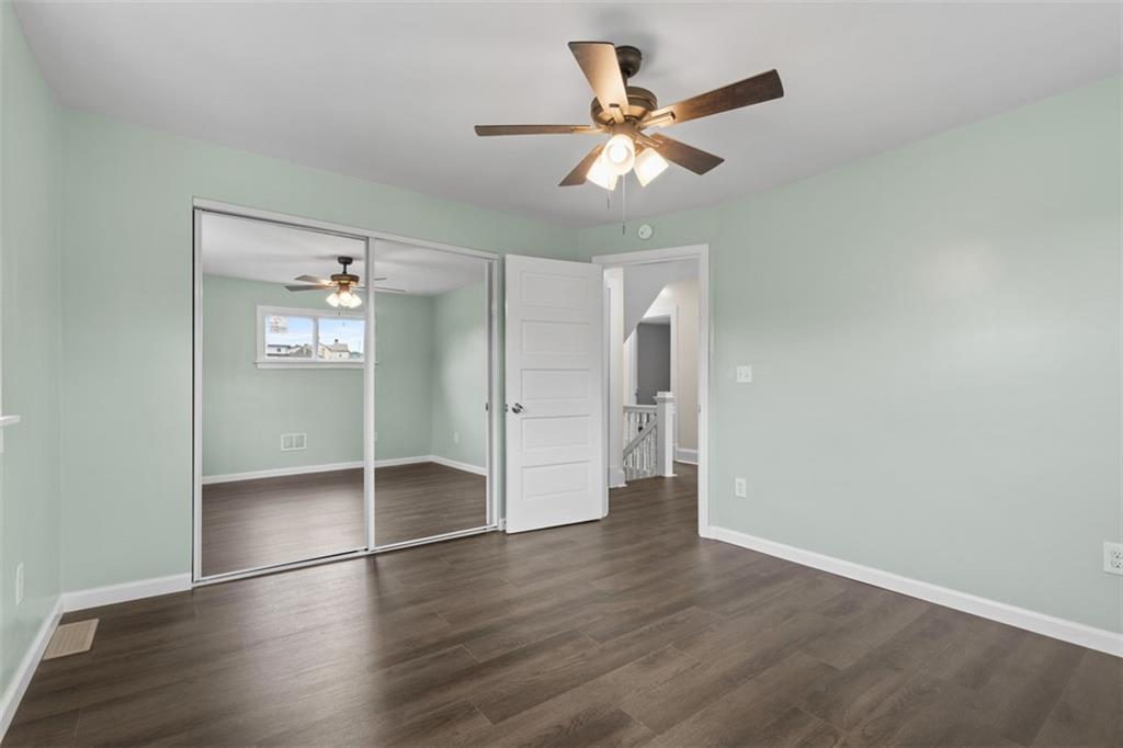 519 Center Street Carnegie, PA 15106 - Photo 26 of 44 an empty room with wooden floor and entryway
