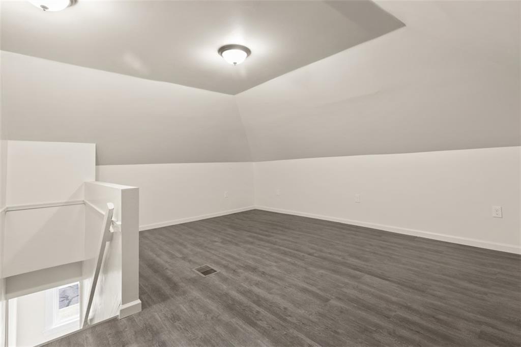 519 Center Street Carnegie, PA 15106 - Photo 27 of 44 a view of an empty room with wooden floor