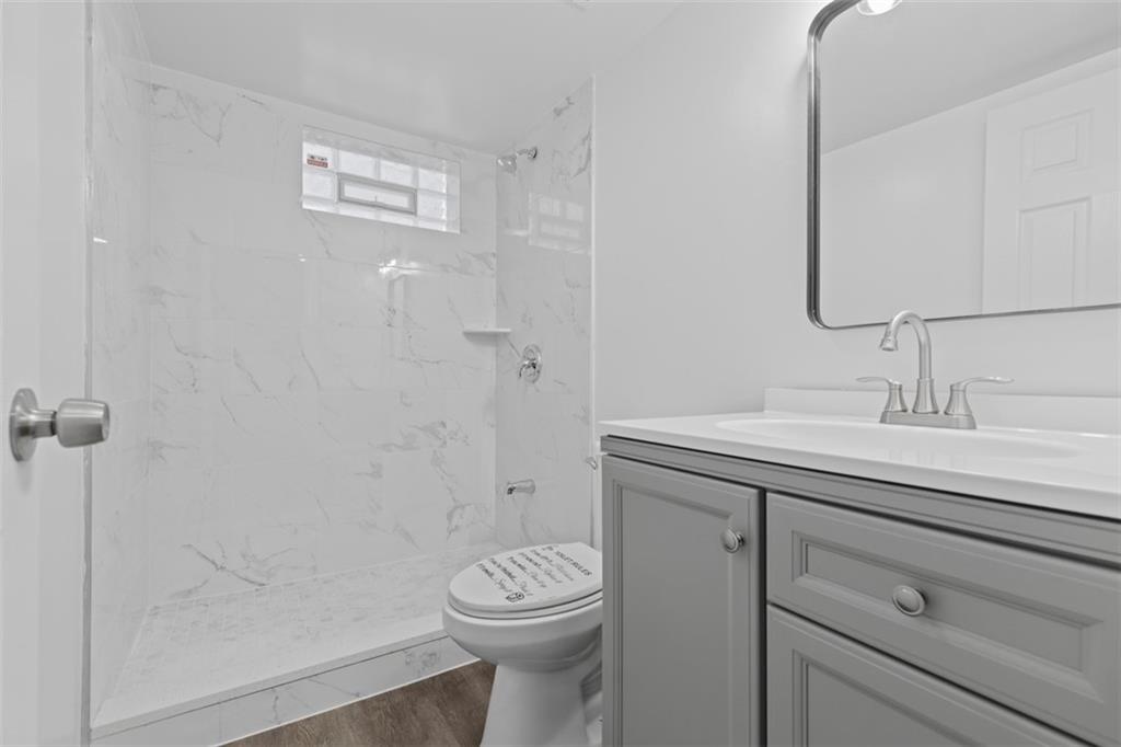 519 Center Street Carnegie, PA 15106 - Photo 32 of 44 a bathroom with a sink a toilet and shower