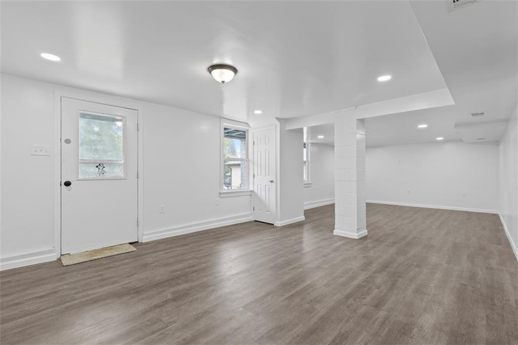 519 Center Street Carnegie, PA 15106 - Photo 33 of 44 an empty room with wooden floor and windows