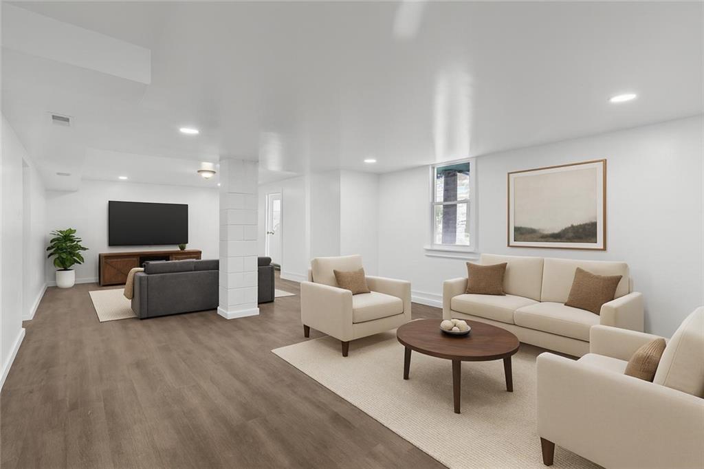 519 Center Street Carnegie, PA 15106 - Photo 34 of 44 a living room with furniture a flat screen tv and a window