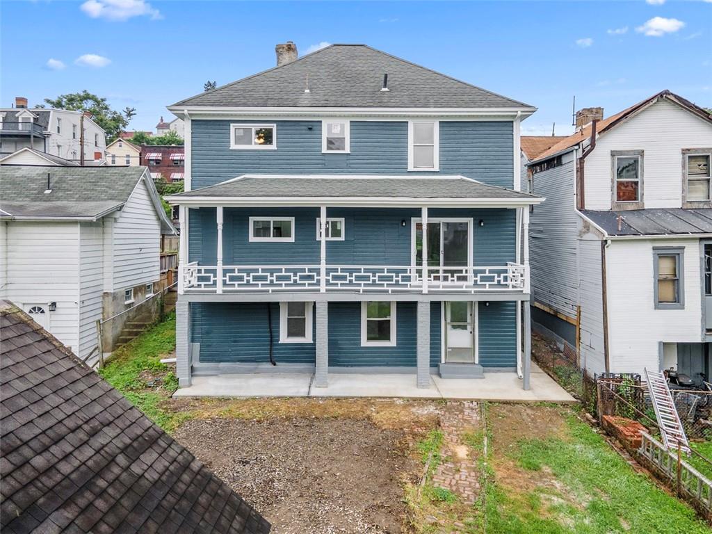 519 Center Street Carnegie, PA 15106 - Photo 39 of 44 a front view of a house with a yard and garage