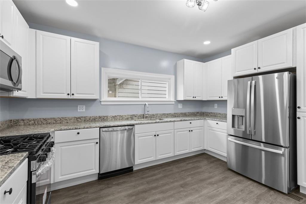 519 Center Street Carnegie, PA 15106 - Photo 9 of 44 a kitchen with appliances a sink and a stove top oven