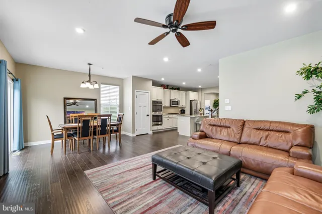 a living room with furniture and a table